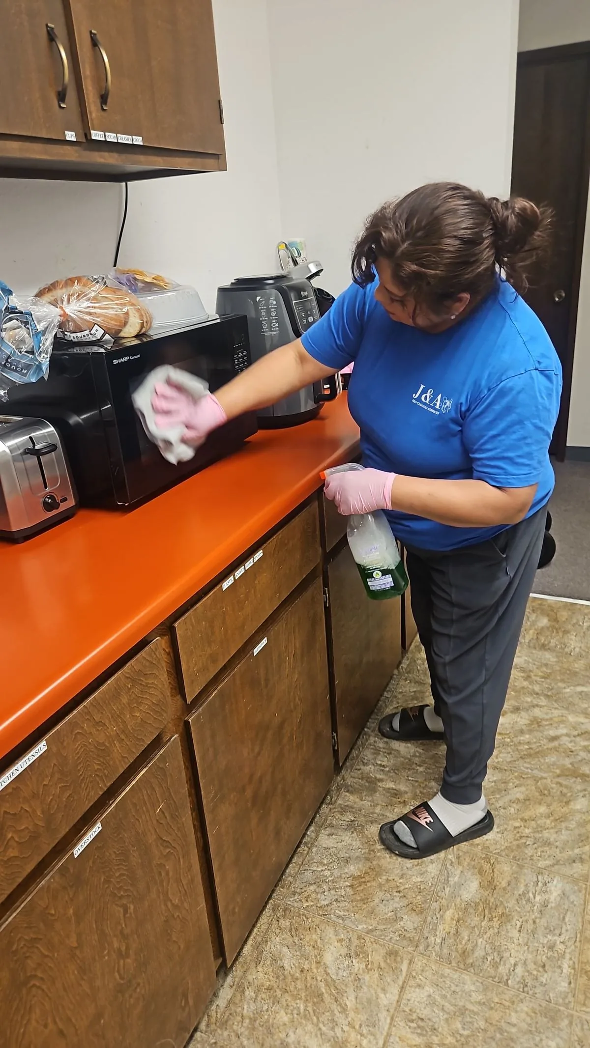 J&A team member cleaning a kitchen during a property turnover