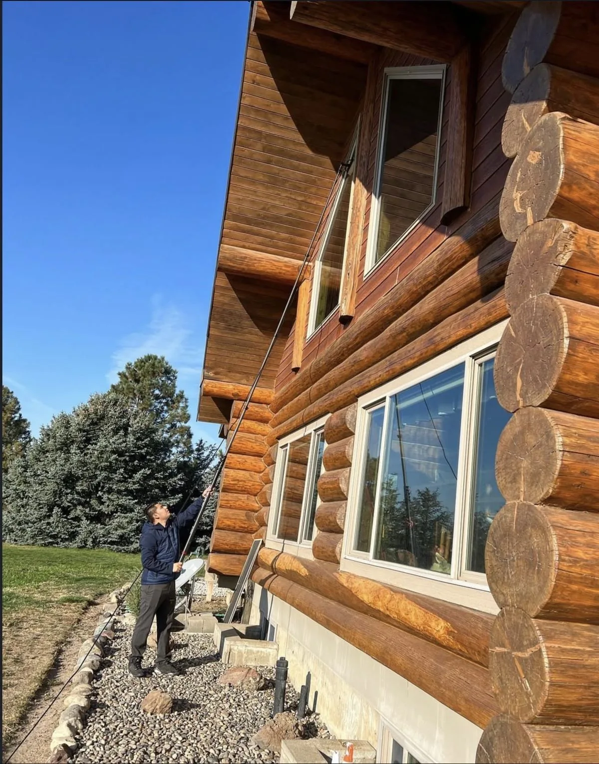 J&A cleaning exterior windows at a local property